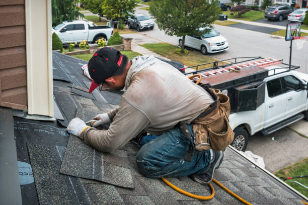Professional Metal Roofing technician working in Amazonia, MO